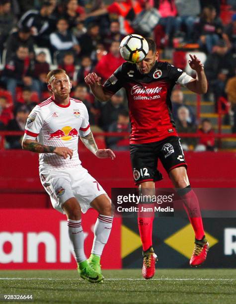 Pablo Aguilar of Tijuana heads the ball during the quarter finals first leg match between Tijuana and New York RB at Caliente Stadium on March 06,...