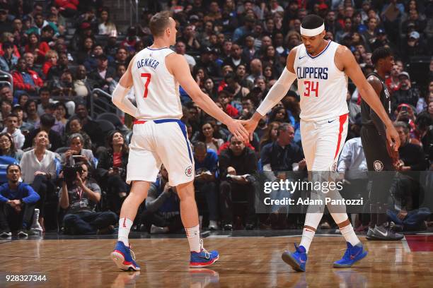 Sam Dekker and Tobias Harris of the LA Clippers exchange handshakes during the game against the Brooklyn Nets on March 4, 2018 at STAPLES Center in...