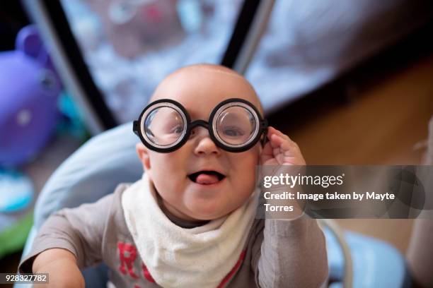 baby wearing short sighted glasses - child eyes closed stock pictures, royalty-free photos & images