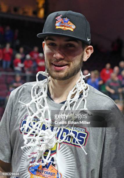 Killian Tillie of the Gonzaga Bulldogs wears a net the team cut down after defeating the Brigham Young Cougars 74-54 to win the championship game of...