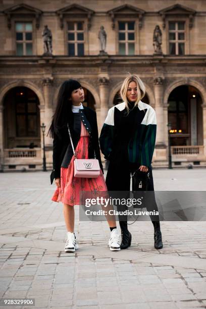 Susanna Lau and Tina Leung are seen in the streets of Paris before the Louis Vuitton show during Paris Fashion Week Womenswear Fall/Winter 2018/2019...