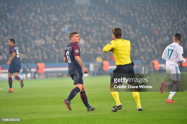 Marco Verratti of PSG receives a second yellow card from referee Felix Brych, so hence a red card, during the UEFA Champions League Round of 16...