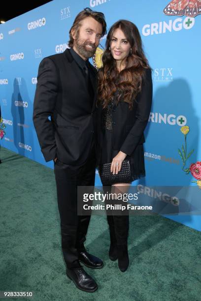 Actor Sharlto Copley and model Tanit Phoenix attend the world premiere of 'Gringo' from Amazon Studios and STX Films at Regal LA Live Stadium 14 on...