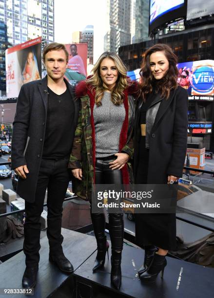 Cast Of "Royals" William Moseley, Elizabeth Hurley and Alexandra Park visit Extra at Hard Rock Cafe - Times Square on March 6, 2018 in New York City.