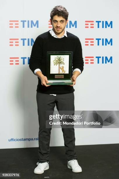 Italian singer Mirkoeilcane at 68th Festival di Sanremo press room. In his hands the Mia Martini award. Sanremo, February 10th 2018