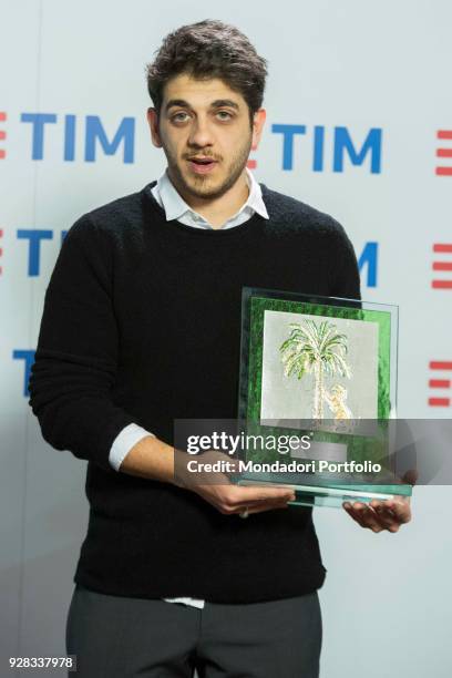 Italian singer Mirkoeilcane at 68th Festival di Sanremo press room. In his hands the Mia Martini award. Sanremo, February 10th 2018