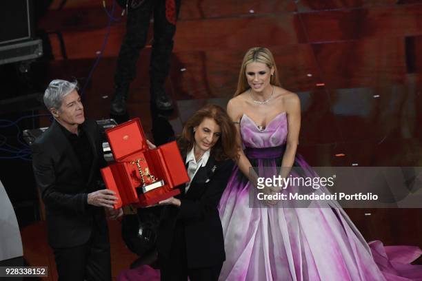 Martina Corgnati, daughter of the italian singer Milva, receive from the hands of the hosts Claudio Baglioni and Michelle Hunziker the career award...
