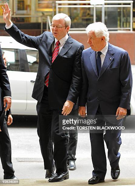 Australian Prime Minister Kevin Rudd is escorted by Australian businessman Frank Lowy into the Lowy Institute in Sydney on November 6, 2009. Rudd...