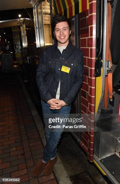 Actor Nick Robinson attends "Love, Simon" Atlanta Fan Screening and Q&A at the Waffle House Food Truck at Regal Atlantic Station on March 6, 2018 in...
