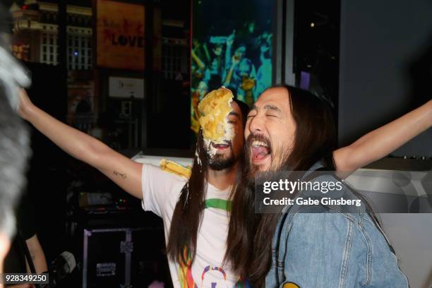 Producer Steve Aoki reacts after throwing a cake at his wax figure at Madame Tussauds Las Vegas at The Venetian on March 6, 2018 in Las Vegas, Nevada.