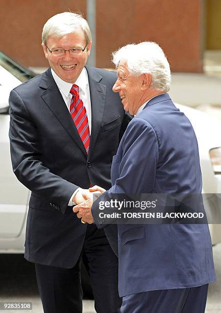 Australian Prime Minister Kevin Rudd is welcomed by Australian businessman Frank Lowy outside the Lowy Institute in Sydney on November 6, 2009. Rudd...