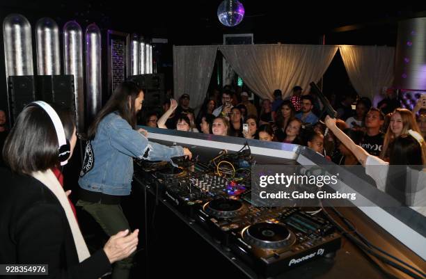 Chizuru Kobayashi watches as her son, DJ/producer Steve Aoki, performs after unveiling his new wax figure at Madame Tussauds Las Vegas at The...