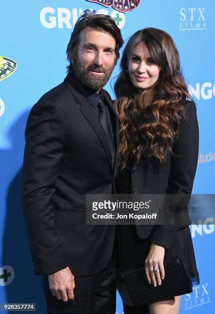 Sharlto Copley and Tanit Phoenix attend the Los Angeles Premiere "Gringo" at Regal LA Live Stadium 14 on March 6, 2018 in Los Angeles, California.