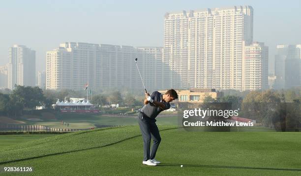 Robert Rock of England plays his second shot on the 18th fairway during a practice round ahead of the Hero Indian Open at Dlf Golf and Country Club...