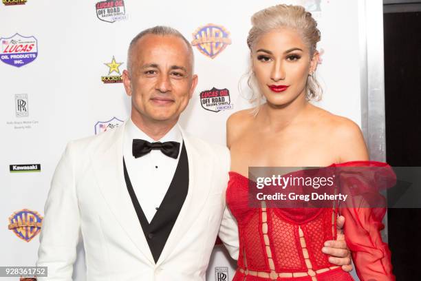 Producer Ali Afshar and Actress Lexy Panterra attend the Premiere Of Warner Bros. Home Entertainment's "Dirt" at TCL Chinese Theatre on March 6, 2018...