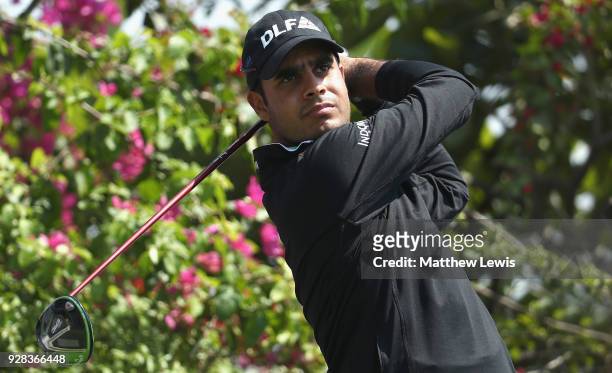 Shubhankar Sharma of India tees offon the 18th hole during a practice round ahead of the Hero Indian Open at Dlf Golf and Country Club on March 7,...