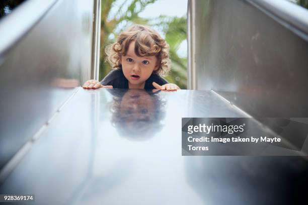 toddler on top of the slide - 2 slides stock pictures, royalty-free photos & images