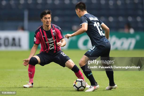 Hirofumi Yamauchi of Cerezo Osaka try to steal the ball from Narubodin Weerawatnodom of Buriram United FC during the AFC Champions League Group G...