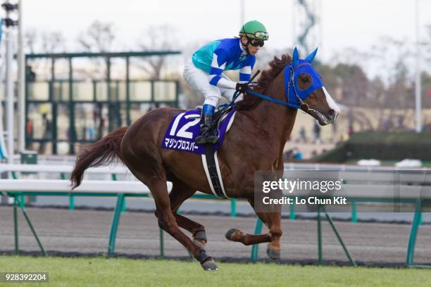 Jockey Suguru Hamanaka riding Majin Prosper during the Takamatsunomiya Kinen at Chukyo Racecourse on March 25, 2012 in Toyoake, Aichi Prefecture,...
