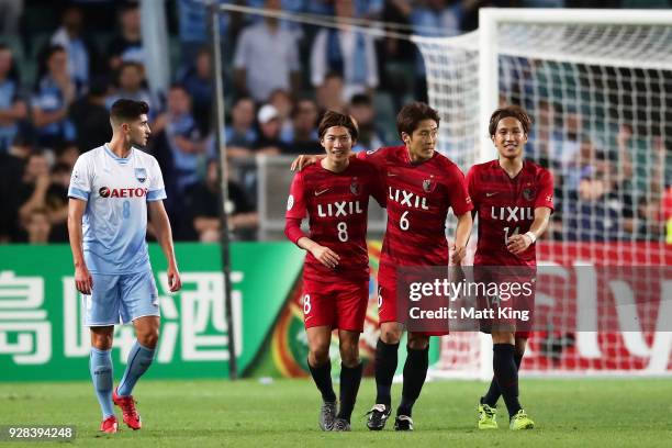 Shoma Doi of Kashima Antlers celebrates with team mates after scoring a goal during the AFC Asian Champions League match between Sydney FC and...