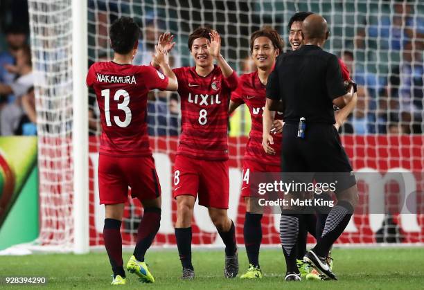 Shoma Doi of Kashima Antlers celebrates with team mates after scoring a goal during the AFC Asian Champions League match between Sydney FC and...