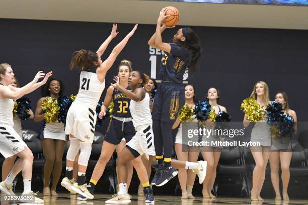 Amy Griffin of the La Salle Explorers takes a shot during a woman's college basketball game against the George Washington Colonials at the Smith...