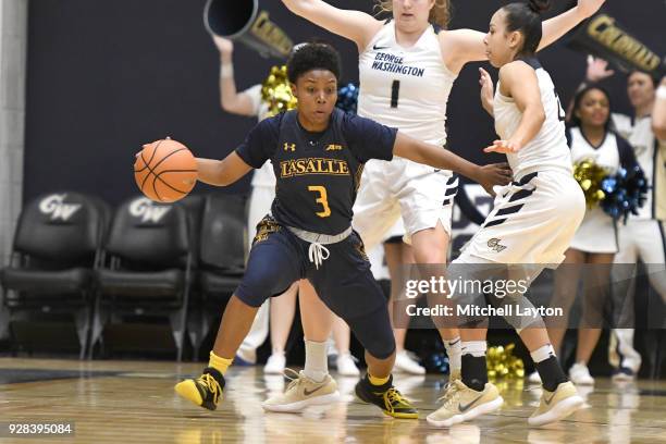 Rayshel Brown of the La Salle Explorers dribbles the ball during a woman's college basketball game against the George Washington Colonials at the...