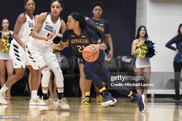 Amy Griffin of the La Salle Explorers dribbles the ball during a woman's college basketball game against the George Washington Colonials at the Smith...