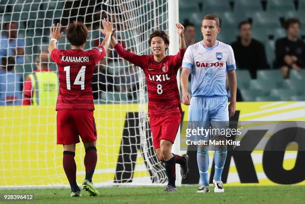Shoma Doi of Kashima Antlers celebrates with team mates after scoring a goal during the AFC Asian Champions League match between Sydney FC and...