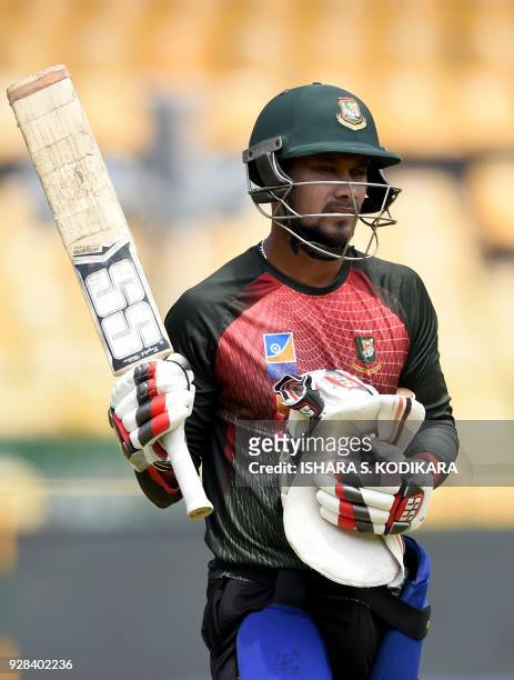 Bangladesh cricketer Sabbir Rahman looks on during a practice session at R. Premadasa International Cricket Stadium in Colombo on March 7, 2018. /...