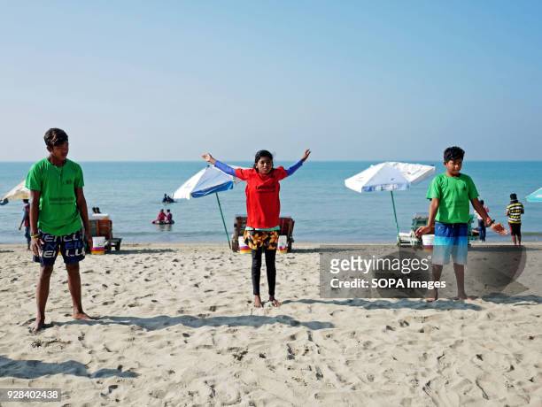 Young people seen warming up. Young people in the world´s longest sandy beach in Cox´s Bazar, Bangladesh, decided to throw away prejudices and start...
