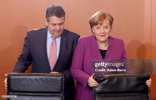 German Chancellor Angela Merkel and Vice Chancellor and Foreign Minister Sigmar Gabriel arrive for the weekly German federal Cabinet meeting on March...