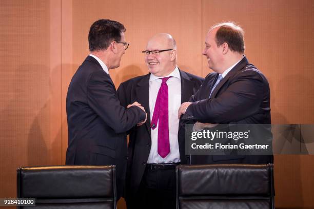 German Development Minister Gerd Mueller , Head of the German Chancellery Peter Altmaier and Minister of State Helge Braun talk before the weekly...
