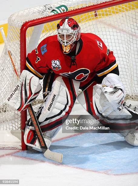 Goaltender Miikka Kiprusoff of the Calgary Flames defends his net against the Colorado Avalanche on October 28, 2009 at the Pengrowth Saddledome in...