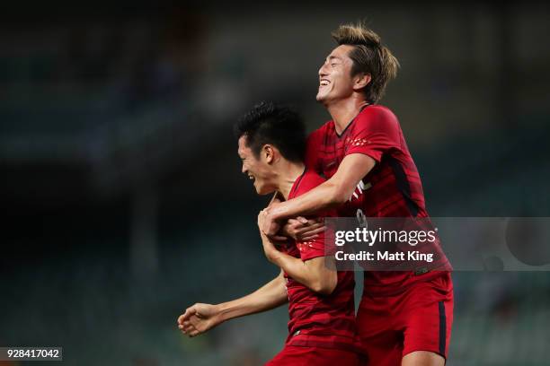 Naomichi Ueda of Kashima Antlers celebrates with Yuma Suzuki of Kashima Antlers after scoring a goal during the AFC Asian Champions League match...