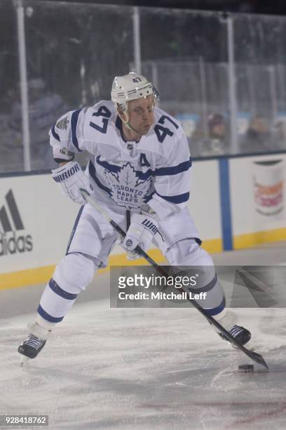 Leo Komarov of the Toronto Maple Leafs controls the puck in the Coors Light NHL Stadium Series game against the Washington Capitals at United States...