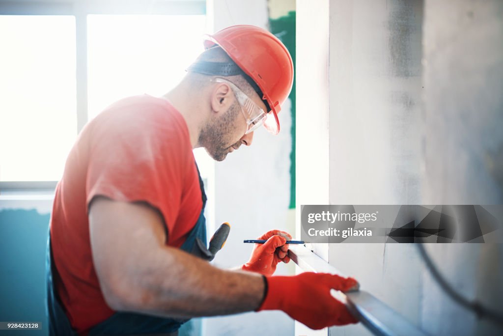 Construction worker during interior decoration.