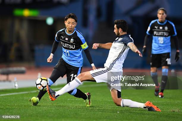 Yu Kobayashi of Kawasaki Frontale compete for the ball against Rhys Williams of Melbourne Victory during the AFC Champions League Group F match...