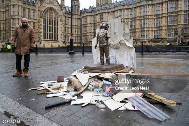 Protest group Save the Children display a statue of a child during a demonstration against the involvement of Saudi Arabia in the ongoing violence in...