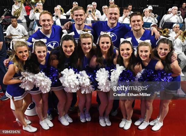 Brigham Young Cougars cheerleaders pose before the championship game of the West Coast Conference basketball tournament between the Cougars and the...