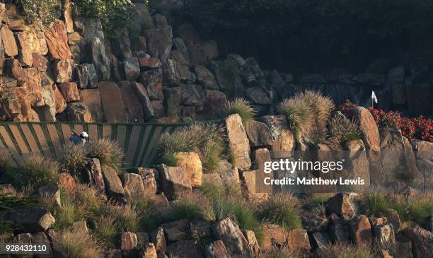 Poom Saksansin of Thailand plays out of a bunker on the 17th hole during a practice round ahead of the Hero Indian Open at Dlf Golf and Country Club...