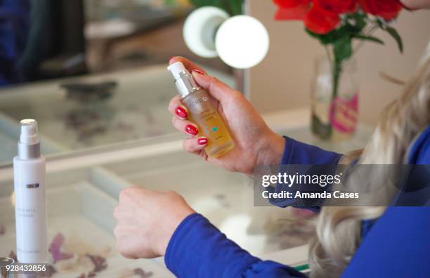 Tia Barr applies Ford MD's Retinol Multi Vitamin Serum at The Artists Project Give Back Day on February 28, 2018 in Los Angeles, California.