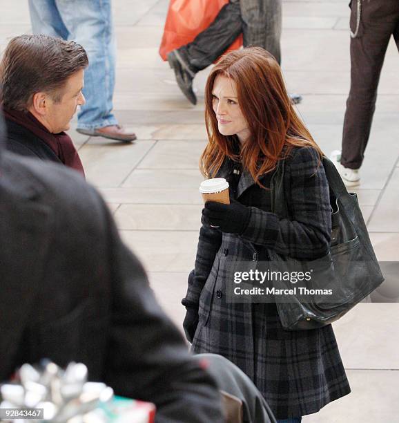 Actors Alec Baldwin and Julianne Moore work on the set of the television show "30 Rock" on location on the streets of Manhattan on November 5, 2009...