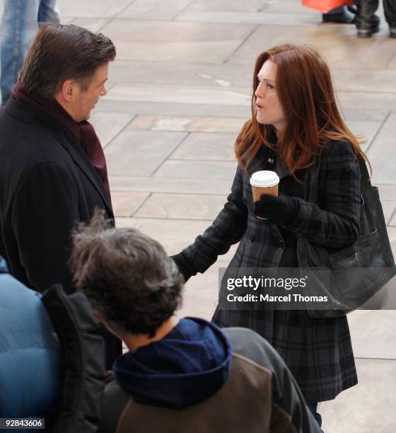 Actors Alec Baldwin and Julianne Moore work on the set of the television show "30 Rock" on location on the streets of Manhattan on November 5, 2009...