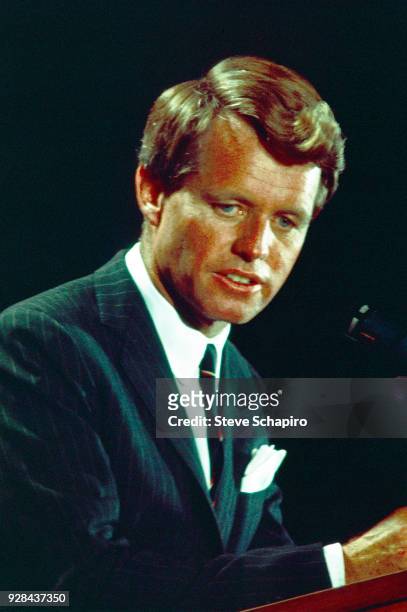 Senator Robert F Kennedy stands at a podium as he delivers a speech during his presidential campaign, Indiana, 1968.
