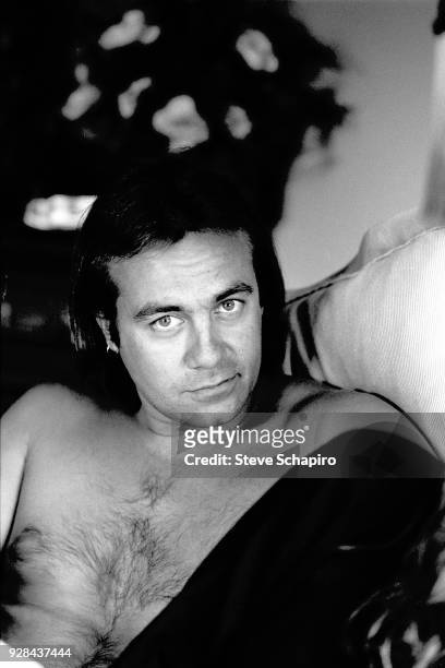 Portrait of shirtless British musician and lyricist Bernie Taupin, Los Angeles, California, April 1980.