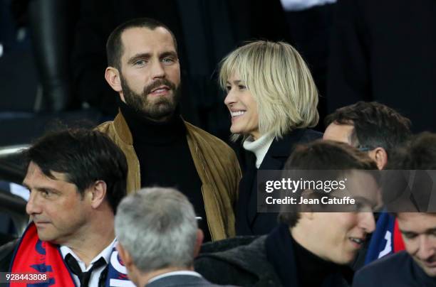 Robin Wright and Clement Giraudet attend the UEFA Champions League Round of 16 Second Leg match between Paris Saint-Germain and Real Madrid at Parc...