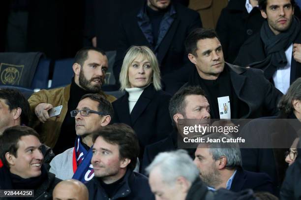 Robin Wright and Clement Giraudet, Dan Carter, below Lothar Matthaus attend the UEFA Champions League Round of 16 Second Leg match between Paris...