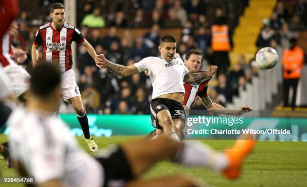 Aleksandar Mitrovic of Fulham scores their 1st goal during the Sky Bet Championship match between Fulham and Sheffield United at Craven Cottage on...