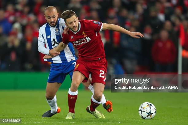 Andre Andre of FC Porto and Adam Lallana of Liverpool during the UEFA Champions League Round of 16 Second Leg match between Liverpool and FC Porto at...